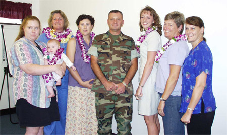 Picture of Brigadier General McAbee with a group of Key Volunteers.