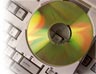 Close-up of a CD-ROM and computer
