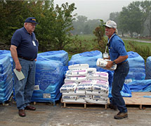 A FEMA Community Relations worker talks with a property owner. FEMA photo.