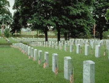 Headstones with flags on each gravesite