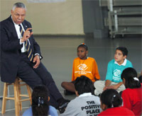Secretary of State Colin Powell talks with youths at a Boys and Girls Club in Atlanta.