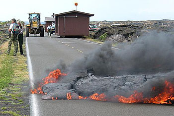 Link to View Lava Safely webpage - Park employees relocate mobile visitor center as lava crosses Chain of Craters Road.