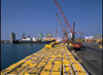 Crane lifting cargo in port