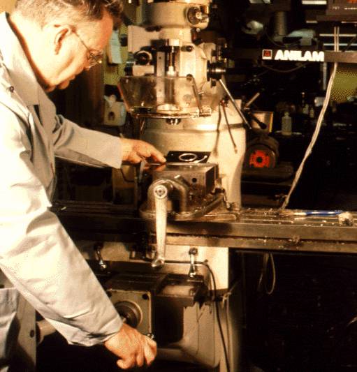 Photo of machinist working on instrument