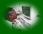 A picture of a man seated at a computer and using assistive technology. The following are the main navigation links.