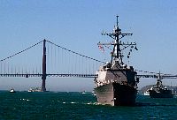 The guided missile destroyer USS Momsen (DDG 92), foreground, and guided missile frigate USS Jarrett (FFG 33) sail into San Francisco Bay.