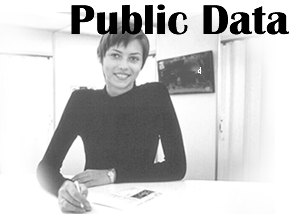 Public Data, black and white photo of a woman in an office