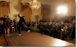 President George W. Bush and Laura Bush watch the performance of Joaquin Cortes as he dances to a quintet of Flamenco musicians during a Hispanic Heritage Month celebration in the East Room of the White House Wednesday, Sept. 15, 2004. White House photo by Joyce Naltchayan.