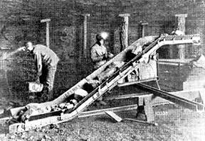 Coal being loaded by hand onto a conveyor in the 19th century.