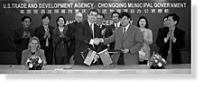[ PHOTO-Mark Dunn, USTDA's Country Manager for China, and Wen Rujun, Director of the Chongqing Inward Investment Project Office, shake hands at a USTDA grant signing in China. ]