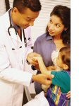 Child and doctor participating in medical exam