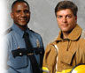 A fireman and policeman standing together