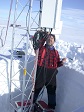 A man with scientific eqipment on a snowy surface.