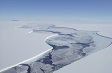 Aerial view of enormous icebergs in the ocean.