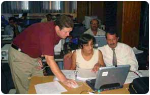 Keith McFadden (USGS, GA) helping two Turkish Cypriots at a class taught by USGS scientists on Advanced Geographic Information Systems.