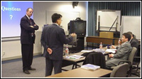 Dick Hainje (left), Director for FEMA Region VII, awaits while interpretor Tushig Dul relates his words to a delegation of senior emergency managers from the country of Mongolia.