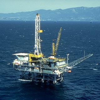 Offshore Oil Platform surrounded by ocean, miles from land.