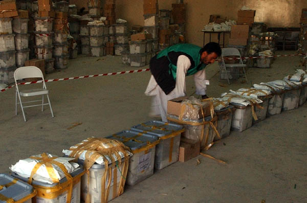 Man sorting ballot boxes in Kabul, Afghanistan, Oct. 12, 2004. AP/Wide World Photo