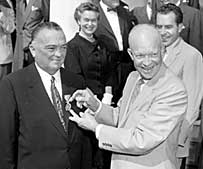 This is a photograph of President Eisenhower presenting J. Edgar Hoover with the National Security Medal at a 1955 Ceremony