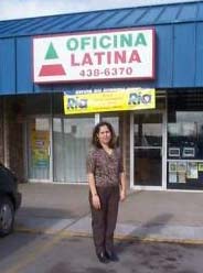 Ana B. Pelayo stands in front of her business which was financed through savings from an Individual Development Account.