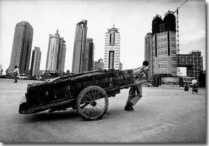 Building up the modern city: migrants are ready to take on all kinds of heavy work  in order to stay in Shanghai.