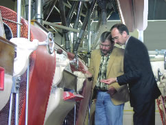 State Director Chuck Banks inspects wheat at the Heartland Mill