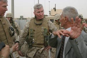 I Marine Expeditionary Force Commanding General, Lt. Gen. James T. Conway, and Regimental Combat Team 1 Commanding Officer, Colonel John A. Toolan, talk with Iraqi army officers on the outskirts of Fullujah, Iraq.  Marines manning key sites within the city repositioned to allow Iraqi forces to take over.
(USMC photo by Lance Cpl. Nathan Alan Heusdens)
 Photo by: Lance Cpl. Nathan Alan Heusdens