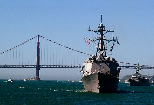 The guided missile destroyer USS Momsen (DDG 92), foreground, and guided missile frigate USS Jarrett (FFG 33) sail into San Francisco Bay.