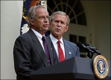 Standing with President George W. Bush, Rep. Porter Goss, R-Fla., addresses the media after the President nominated him to be the director of the CIA in the Rose Garden, Tuesday, Aug. 10, 2004.