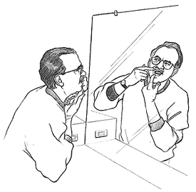 Image of a man examining his teeth and gums in the mirror.