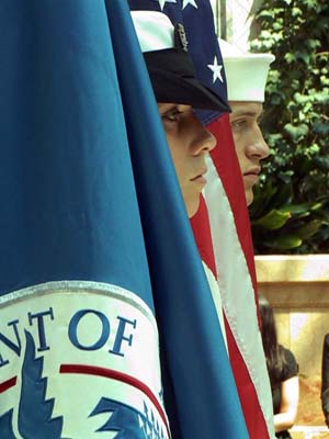 Members of the United States Navy Honor Guard stand with the United States Flag and the Department of Homeland Security Flag during a naturalization ceremony held on Thursday, July 1, 2004 at the Harold Washington Library in Chicago.  Two-hundred new Americans representing 49 countries were sworn-in during the ceremony.
