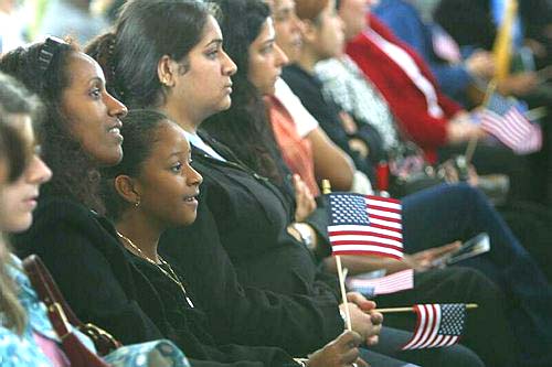 Families show support at the Ellis Island citizenship ceremony.