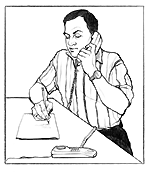 Man on phone writing down information