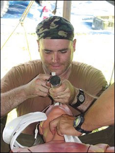Lt. Joseph Meade, a registered nurse participating in the Golden Medic exercise, practices putting a trachea tube in a dummy. The exercise, held at Fort Gordon June 8-16, involved more than 10 Reserve units from across the country.