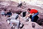 Scientist working on continuous gas monitoring equipment, Kilauea Volcano, Hawai`i