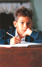Young student studing in classroom.