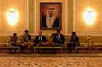 Defense Secretary Donald H. Rumsfeld and staff wait in a distinguished visitor holding area after arriving in Kuwait City, Kuwait, Feb. 22, 2004.
