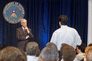 Secretary of the Navy Gordon England listens to a question during a Pentagon town hall meeting.