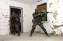 Infantrymen storm a building in Ustka, Poland, during urban assault training.