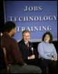 President George W. Bush chats with students about education and job training at Forsyth Technical Community College in Winston-Salem, N.C., Friday, Nov. 7, 2003 White House photo by Paul Morse.