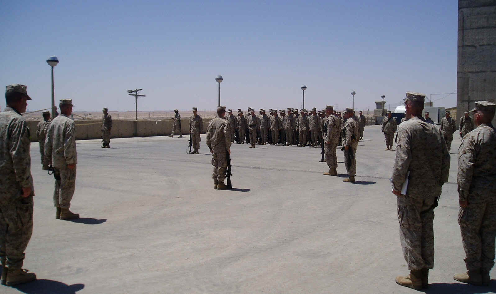 LtCol Brandl and SgtMajor Hope uncase the Battalion Colors at  Haditha Dam, as 1st Bn, 8th Marines relieves 3rd  Bn, 4th Marines in Al Anbar Province, Iraq.