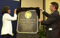 At the dedication of AHRQ's new building, named the John M. Eisenberg, M.D. Building, after the Agency's late director, his wife DD Eisenberg and Secretary Tommy Thompson unveil a plaque honoring his memory. HHS Photo by Chris Smith.
