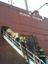 Firefighters're approaching engineering areas and shipboard firefighting equipment