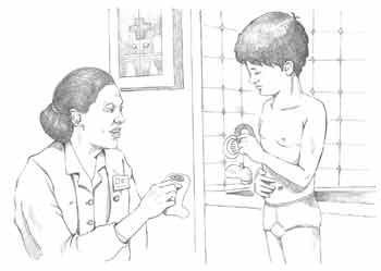 Nurse explaining how to take care for a stoma to a boy.