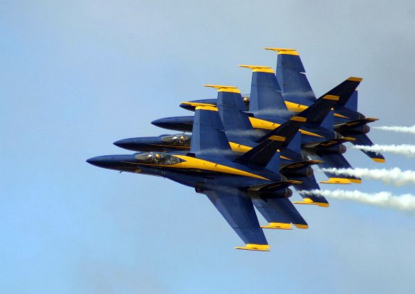 Four F/A-18A Hornets assigned to the U.S. Navy flight demonstration team, the Blue Angels, fly in formation.