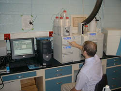 A photo of scientist using computer for research