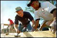 President George W. Bush works on a Habitat For Humanity house in Tampa, Fl., Tuesday, June 5, 2002. 