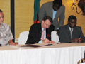 Secretary Thompson and Ng’andu Peter Magande, Zambian Finance Minister, sign a Memorandum of Understanding between Zambian government and the Global Funds to fight AIDS, Malaria, and Tuberculosis.
