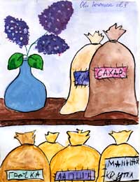 Food bags sit on and under a table. A purple flower in a vase also sits on the table.