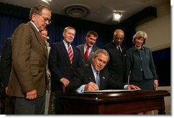 President George W. Bush signs into effect the Indian Education Executive Order in Room 450 of the Old Executive Building on April 30, 2004. White House photo by Paul Morse.